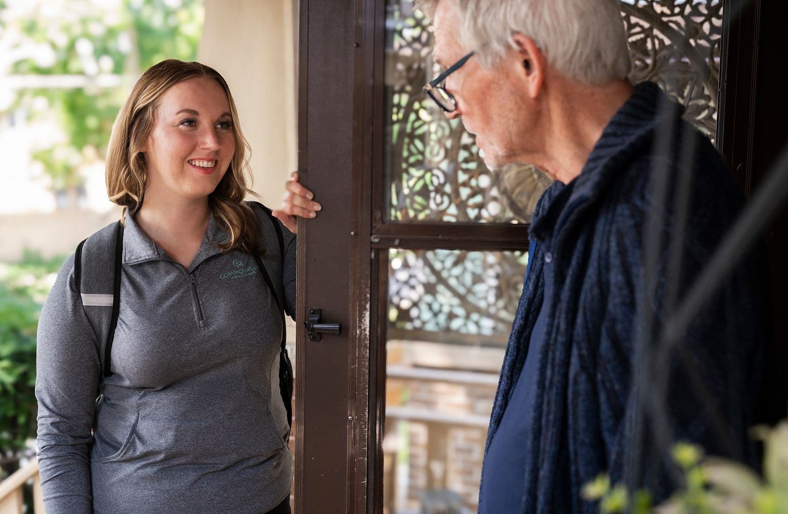 A Commonheart Hopsice nurse coming to the door of a patients house