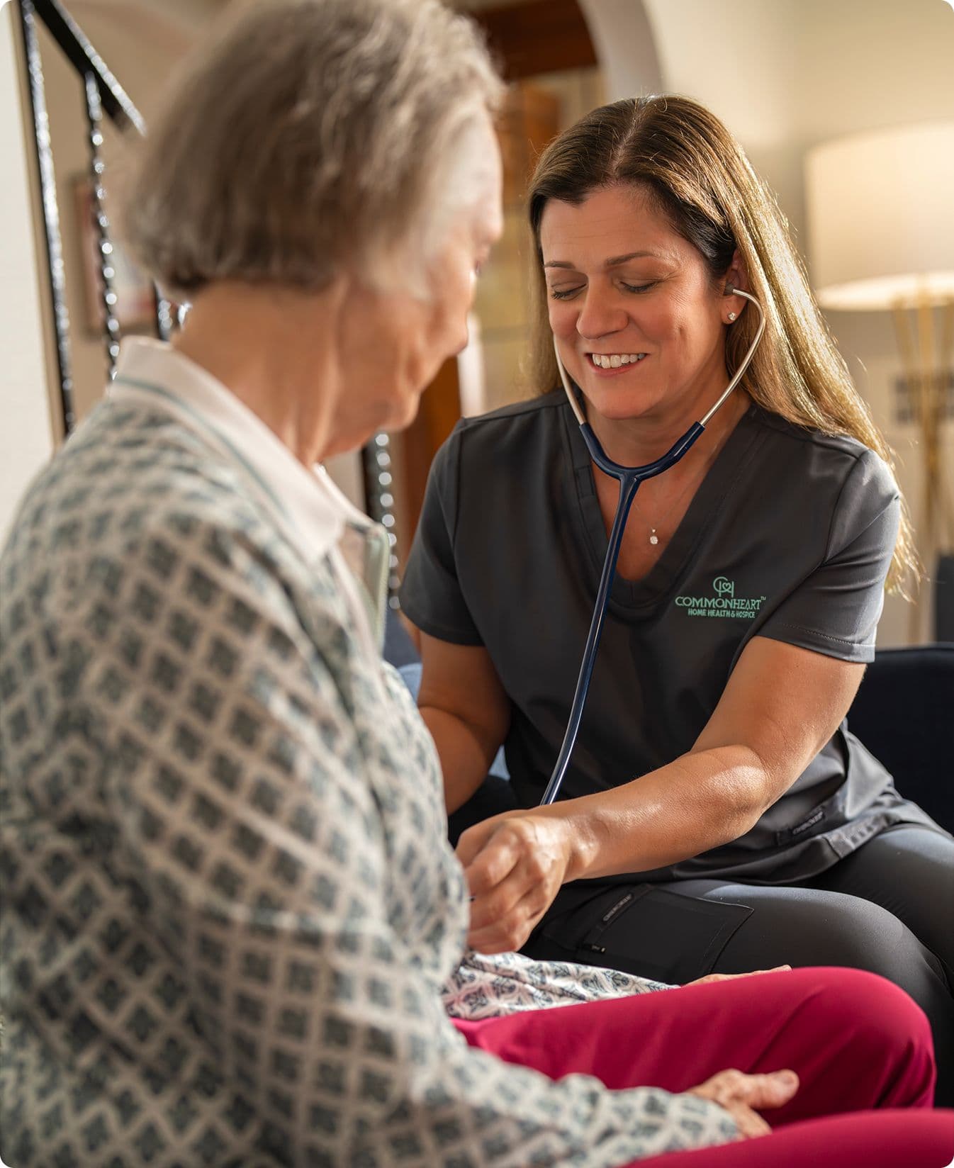 A Commonheart nurse taking a patients blood pressure